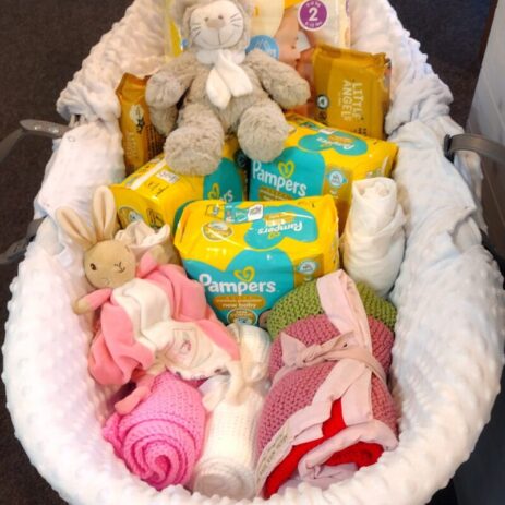 moses basket with nappies, bedding etc